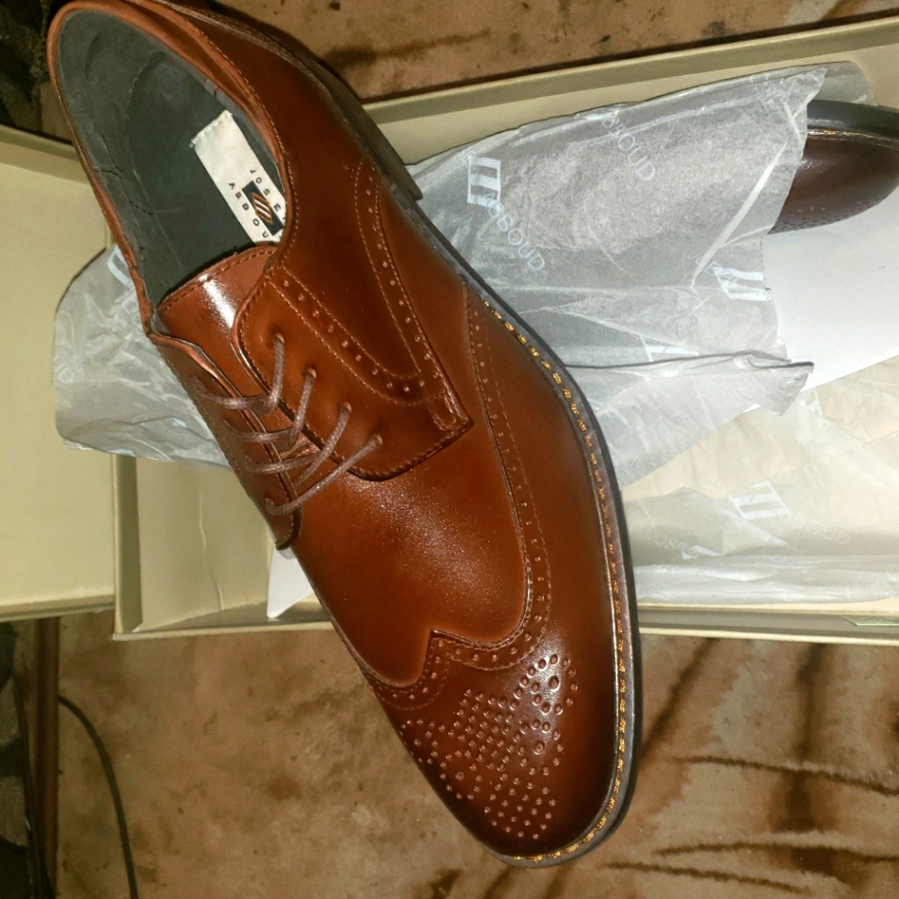 Men's brown wingtip leather dress shoe